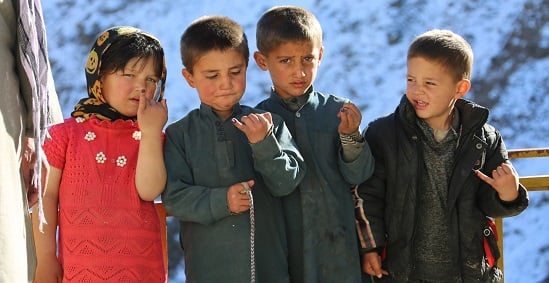 Four children display finger marking